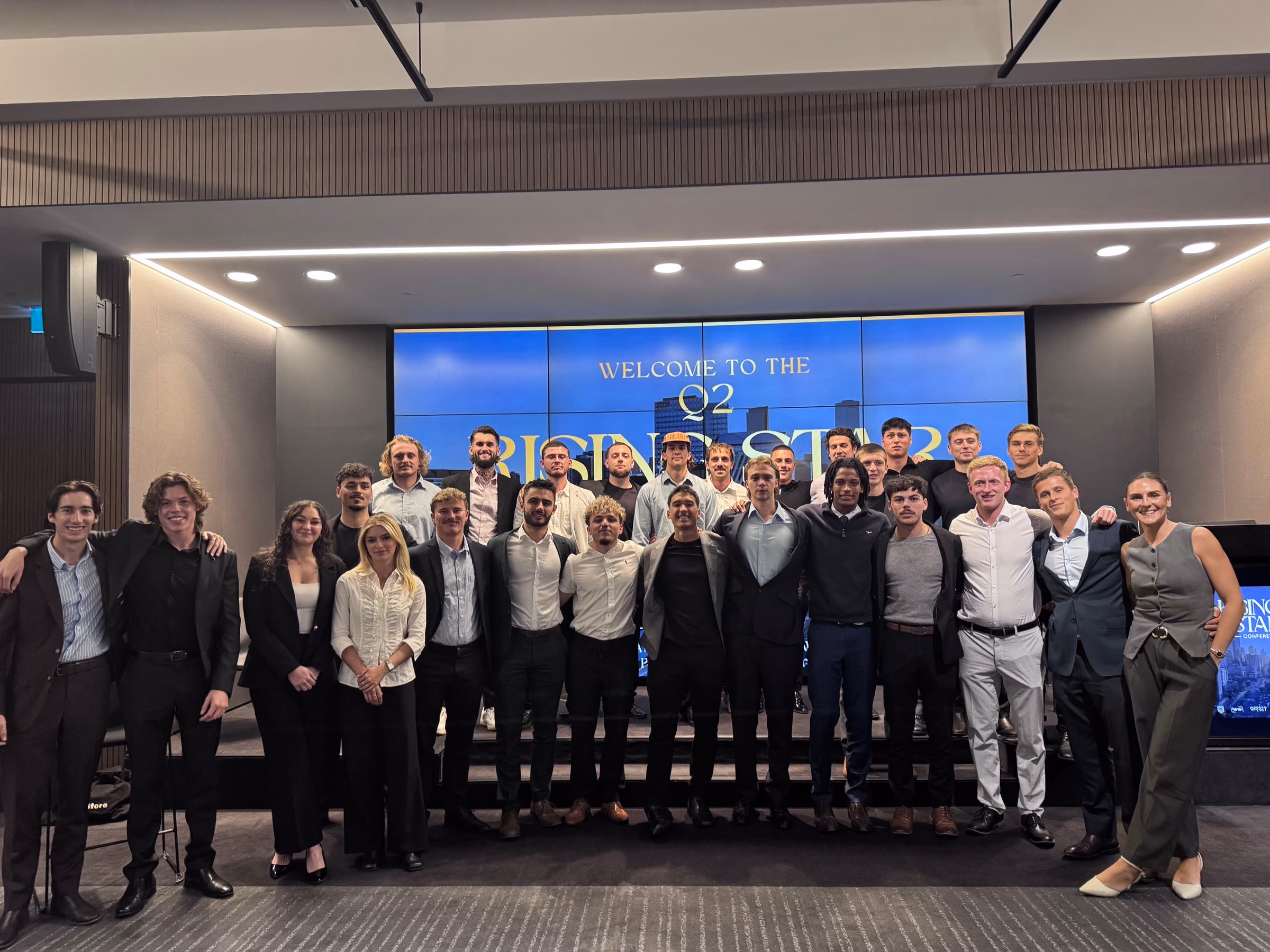 The Unlmted team on stage at the Q2 Rising Star conference